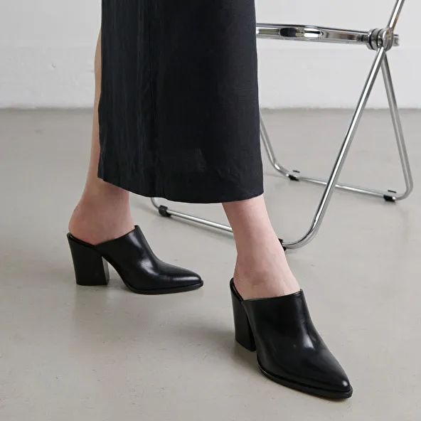 Mules with high heels in black leather